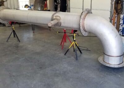 Large pipe with elbow turn flanges and expansion joiner