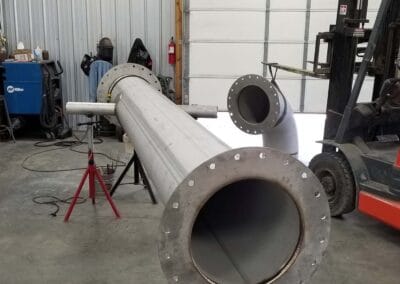 gigantic metal pipes before assembly